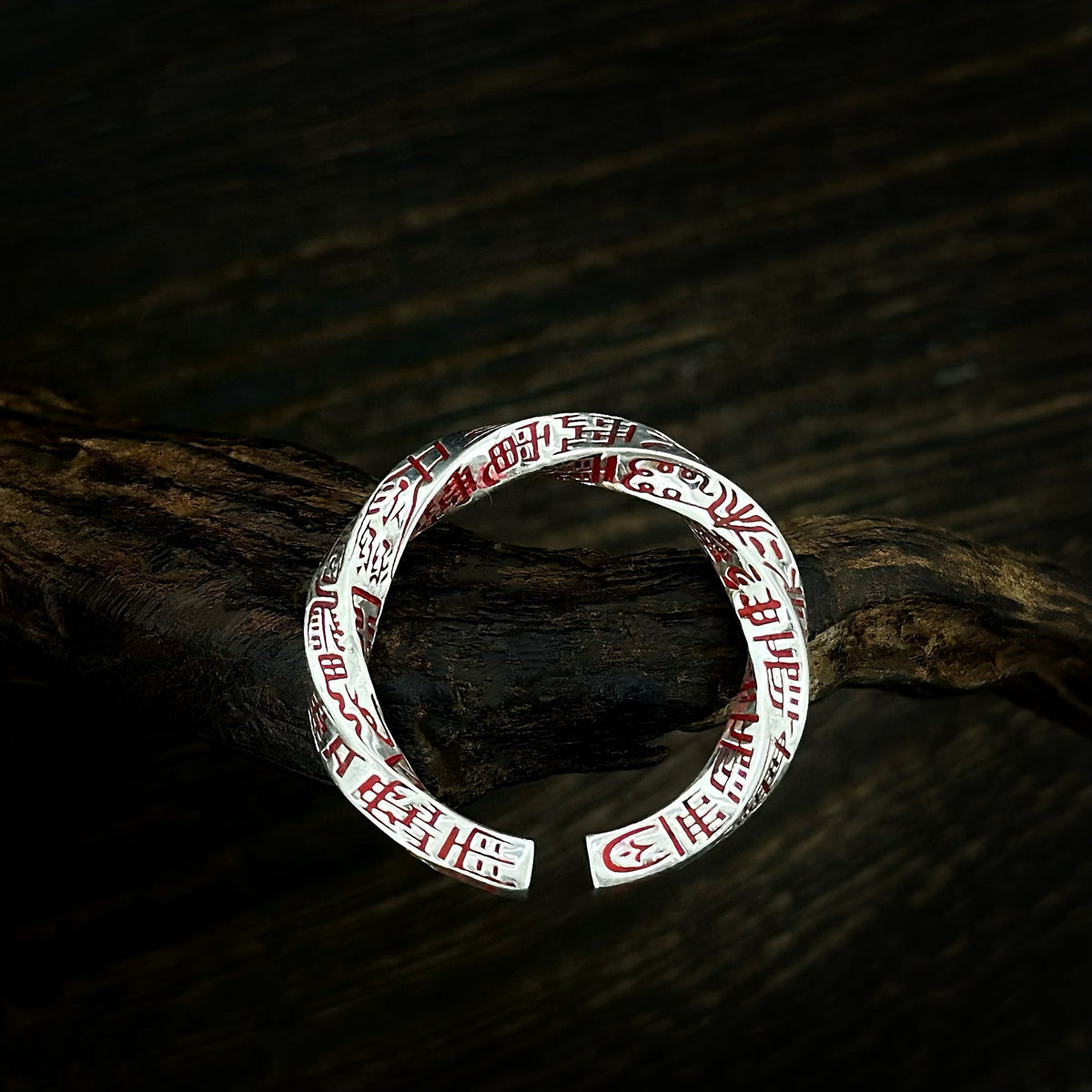 TaoWards Twisted Engraved Open Ring on dark wood