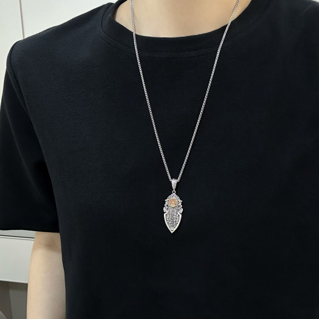 TaoWards ornate pendant worn over a black shirt; chain not included