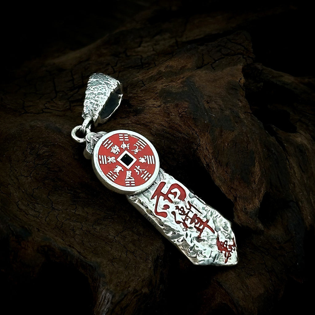 Reverse of the TaoWards sword coin pendant showing red coin and inscription details.