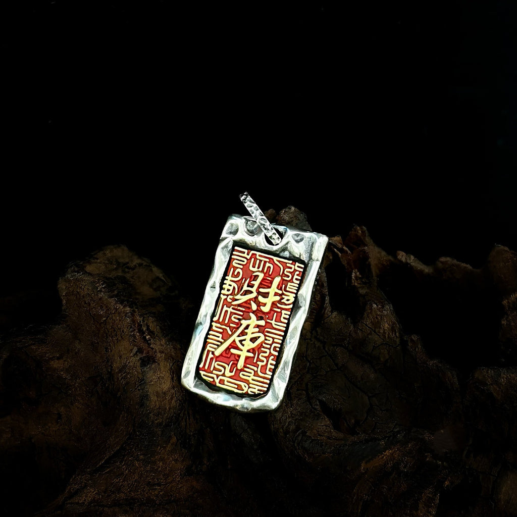 TaoWards Red Engraved Tag Pendant on dark wood