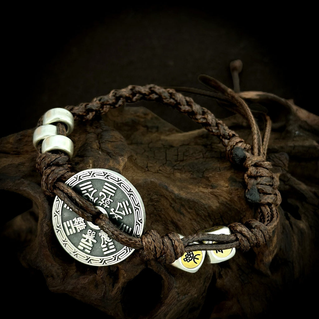 Reverse coin face and knotted closure of TaoWards braided cord bracelet