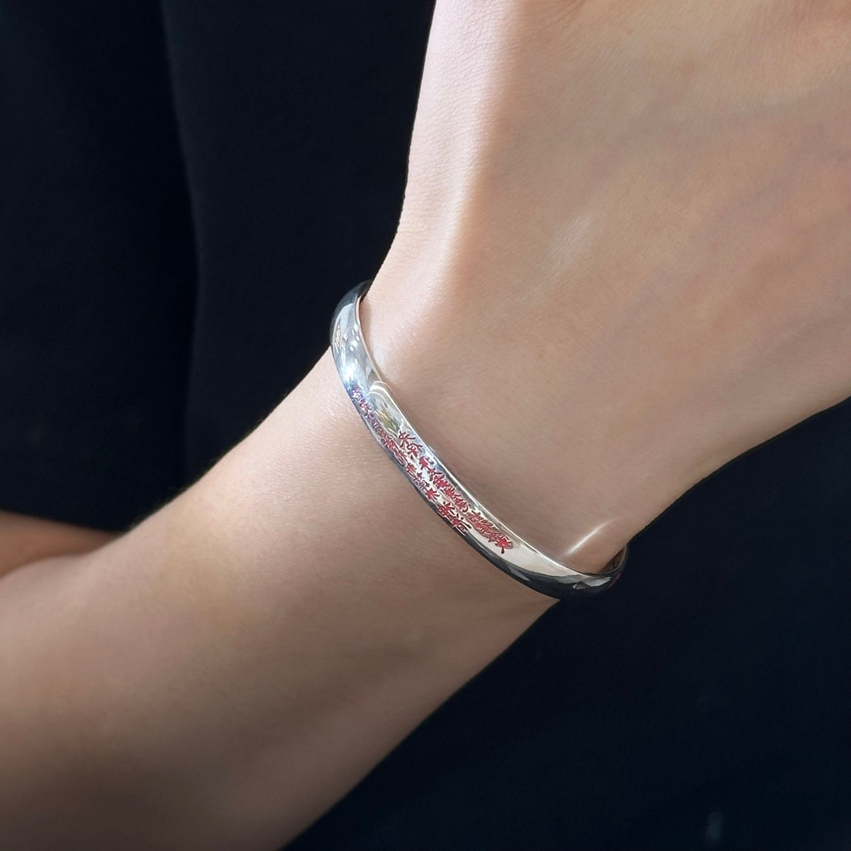 TaoWards Red Inscription Cuff Bracelet worn on a wrist