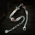 Full TaoWards Seven Star Sword Bracelet with clasp and extension chain on dark wood.