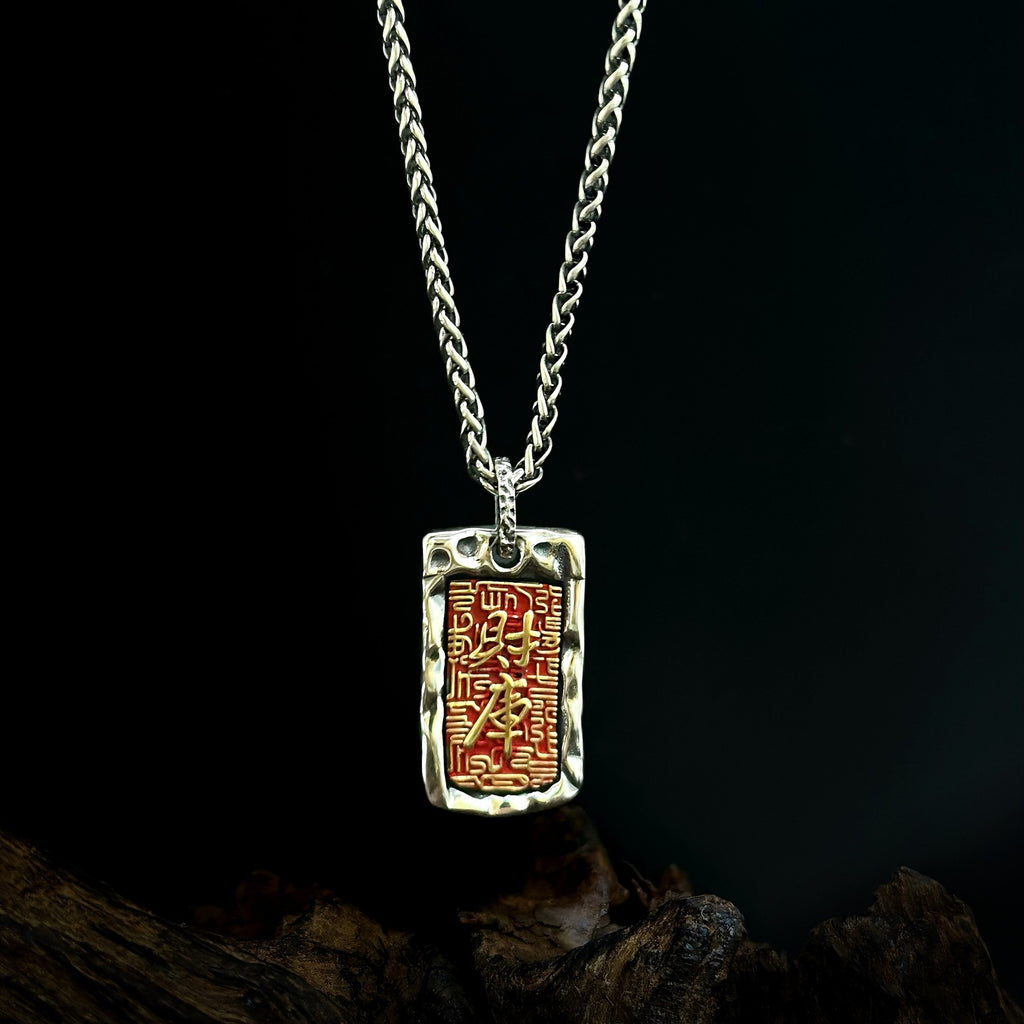 Red tag pendant styled with a chain; chain not included