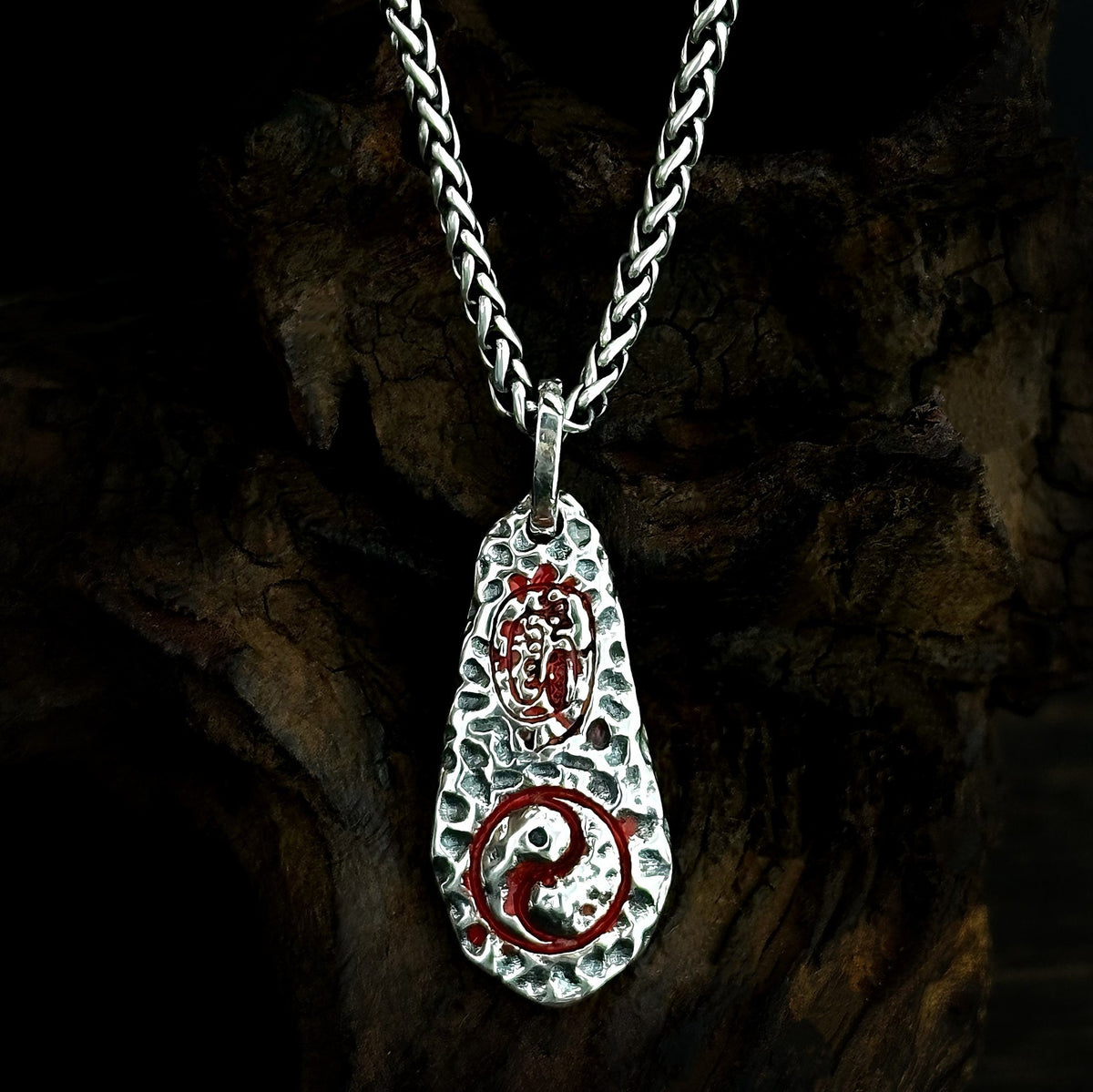 TaoWards yin-yang teardrop pendant styled on a chain; chain not included