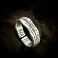 TaoWards Five Wealth Gods Open Ring with red inscriptions on dark wood.