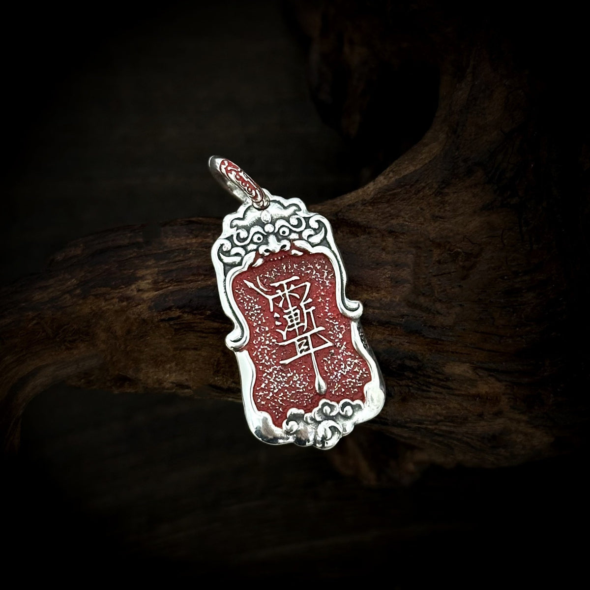 Front of the TaoWards Ziwei talisman tablet pendant with red cinnabar inscriptions and a silver frame.