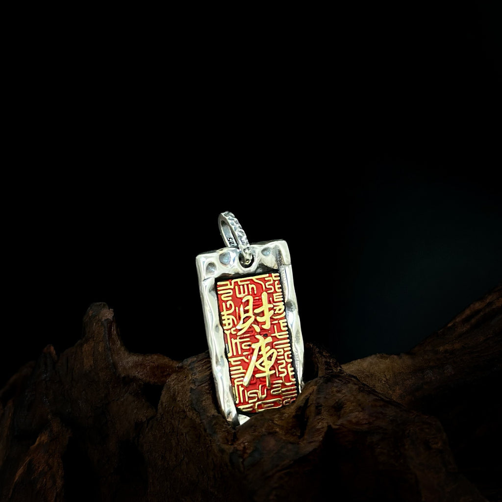 Close view of the red engraved tag pendant