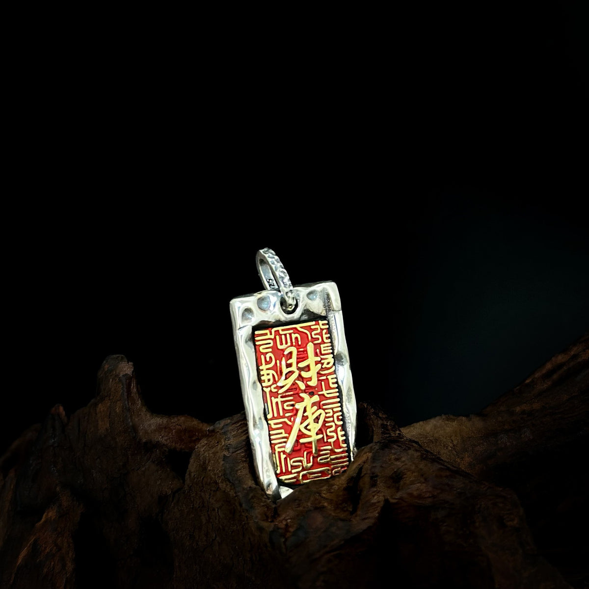 Close view of the red engraved tag pendant