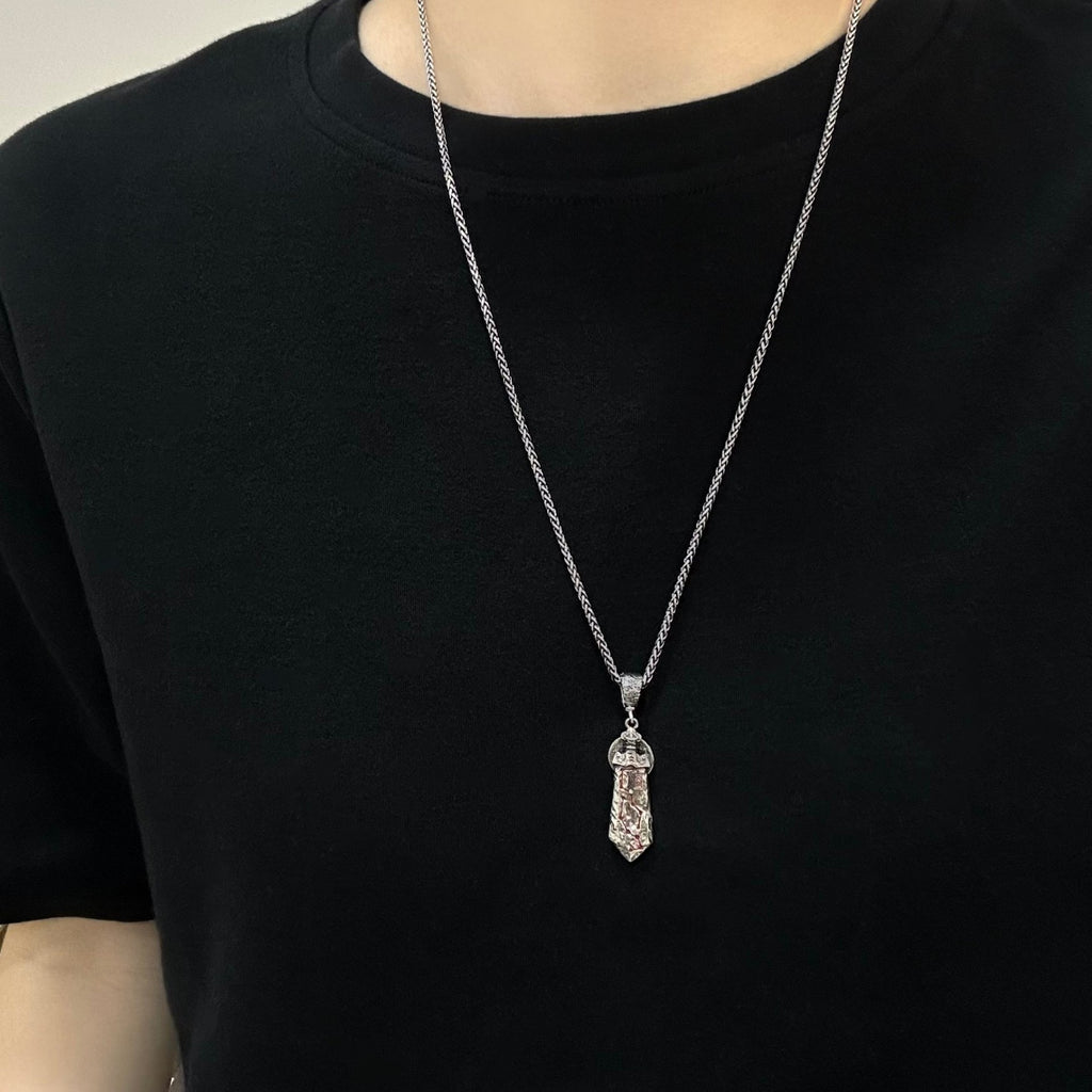 TaoWards sword coin pendant worn over a black T-shirt; chain not included.