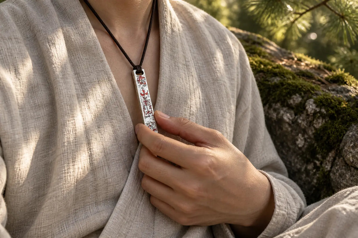 Tianpeng silver pendant worn with ivory linen in natural pine light